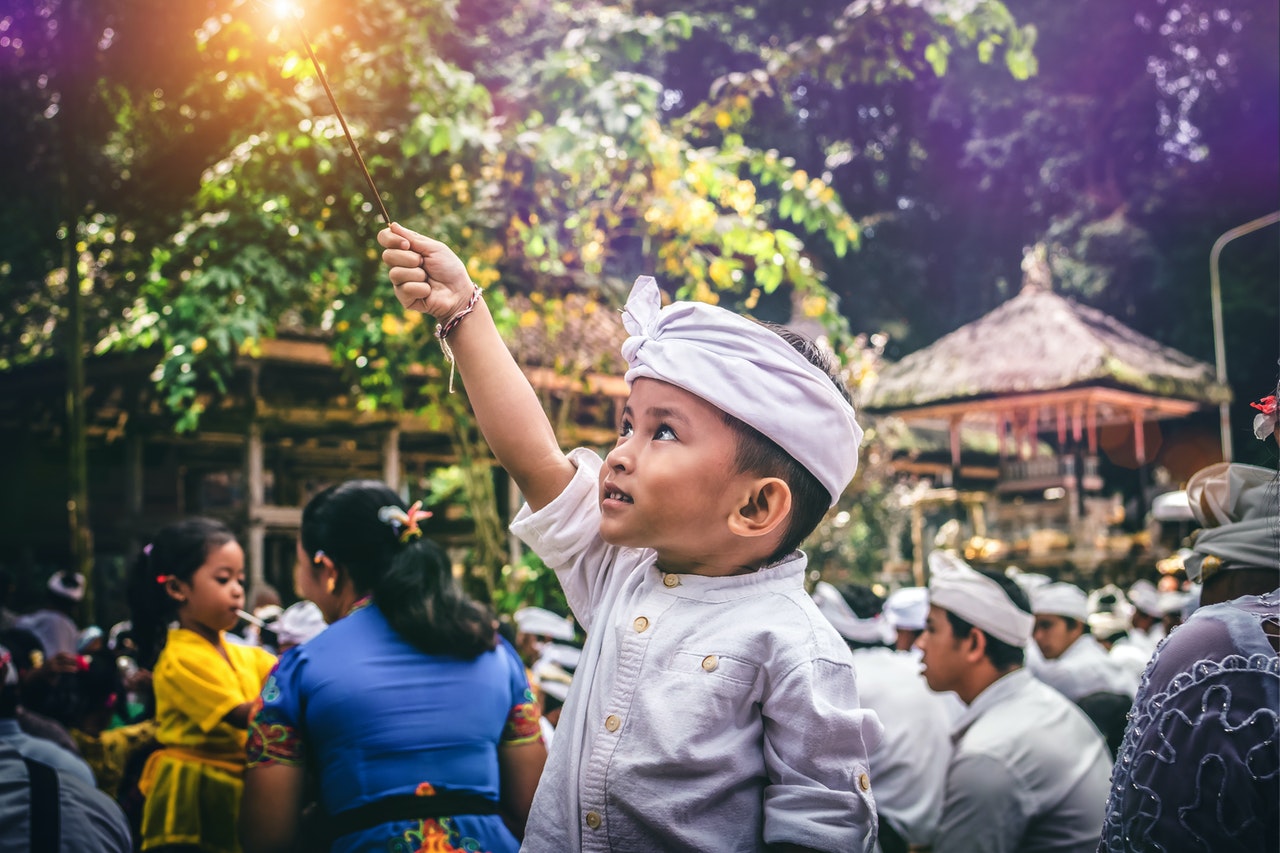 Boy holding a sparkler in Marga 印尼