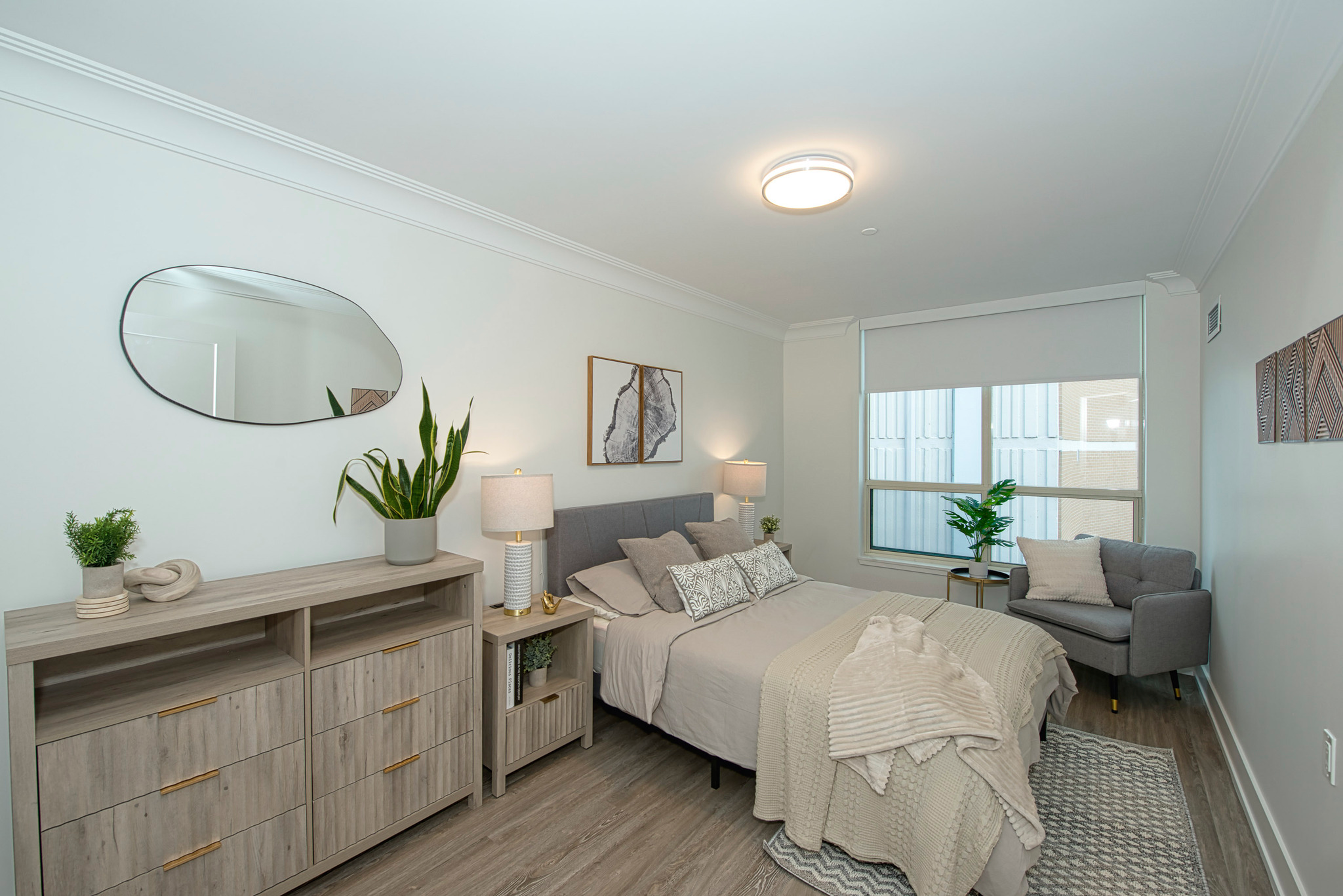 Kensington Model Suite Bedroom. Experience luxurious, hotel-inspired retirement living at The Kensington Oakville. The Kensington is the perfect retirement haven with our stunning rooftop garden, prime downtown location, captivating harbour views, and personalized care.