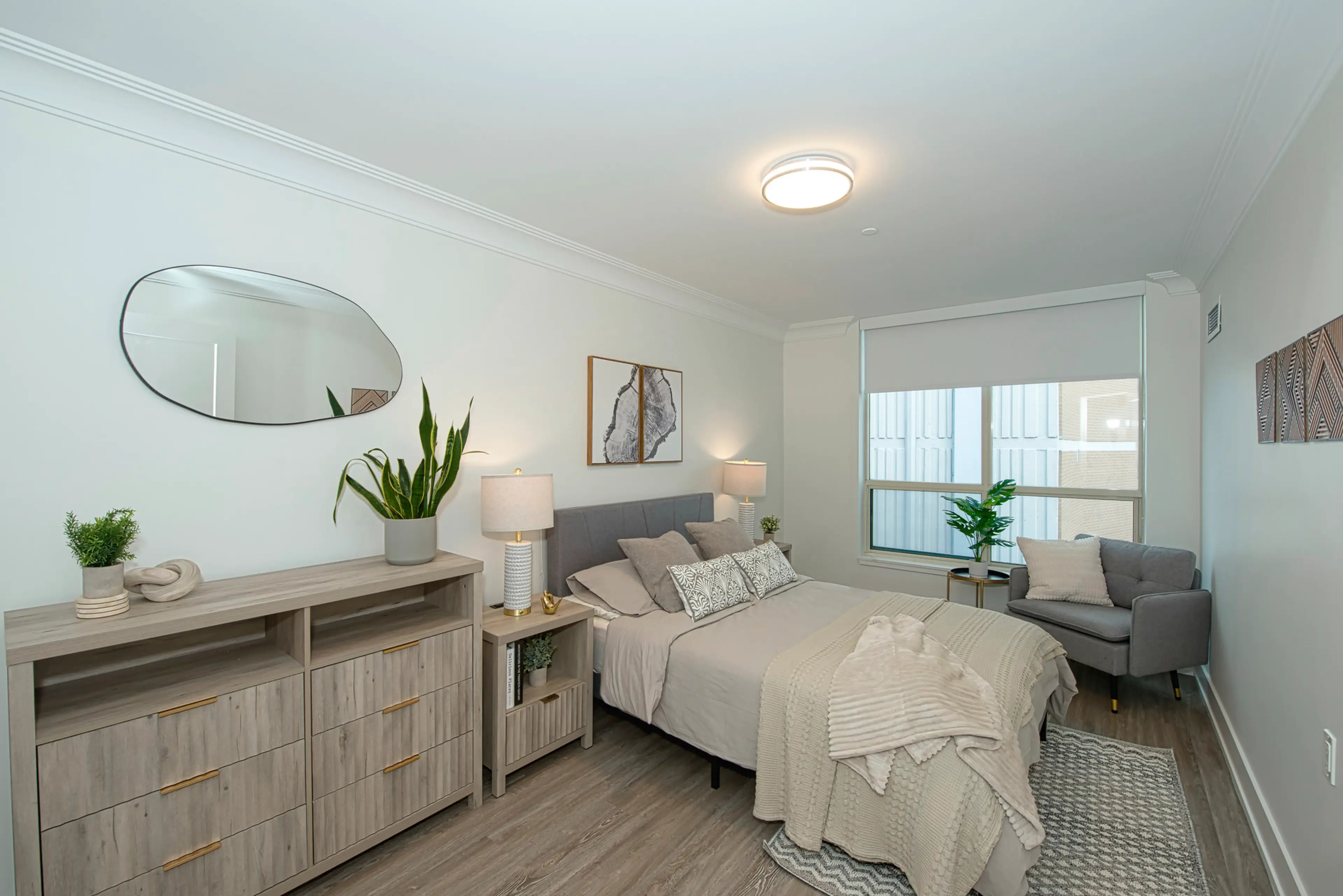 Kensington Model Suite Bedroom. Experience luxurious, hotel-inspired retirement living at The Kensington Oakville. The Kensington is the perfect retirement haven with our stunning rooftop garden, prime downtown location, captivating harbour views, and personalized care.