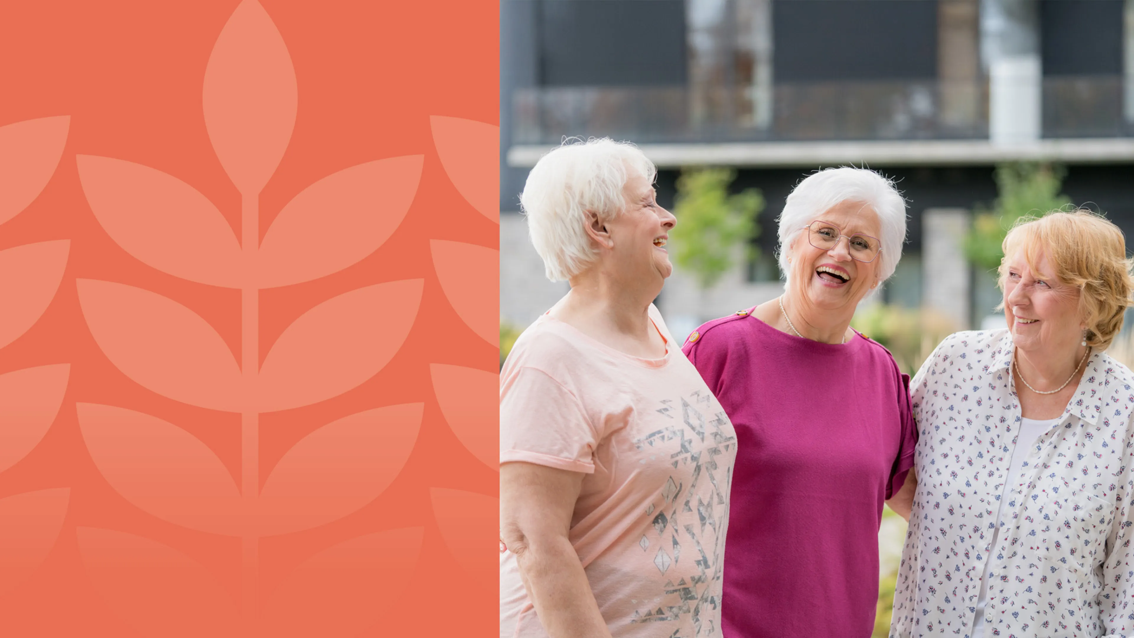 Three seniors ladies embrace outside while laughing.