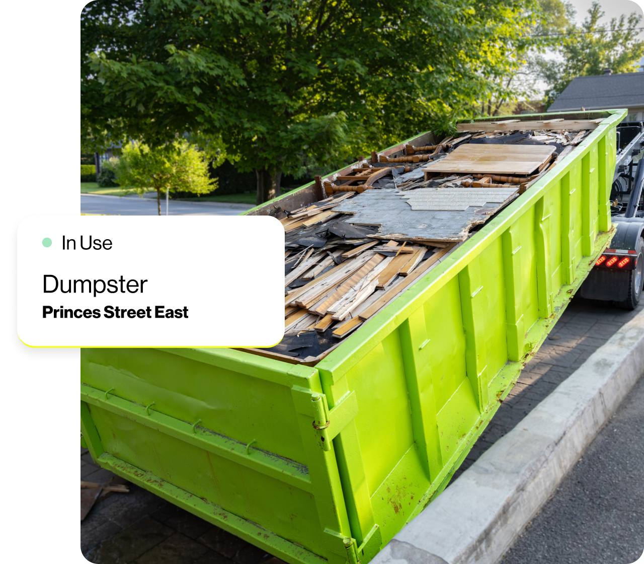A dumpster full of scrap wood