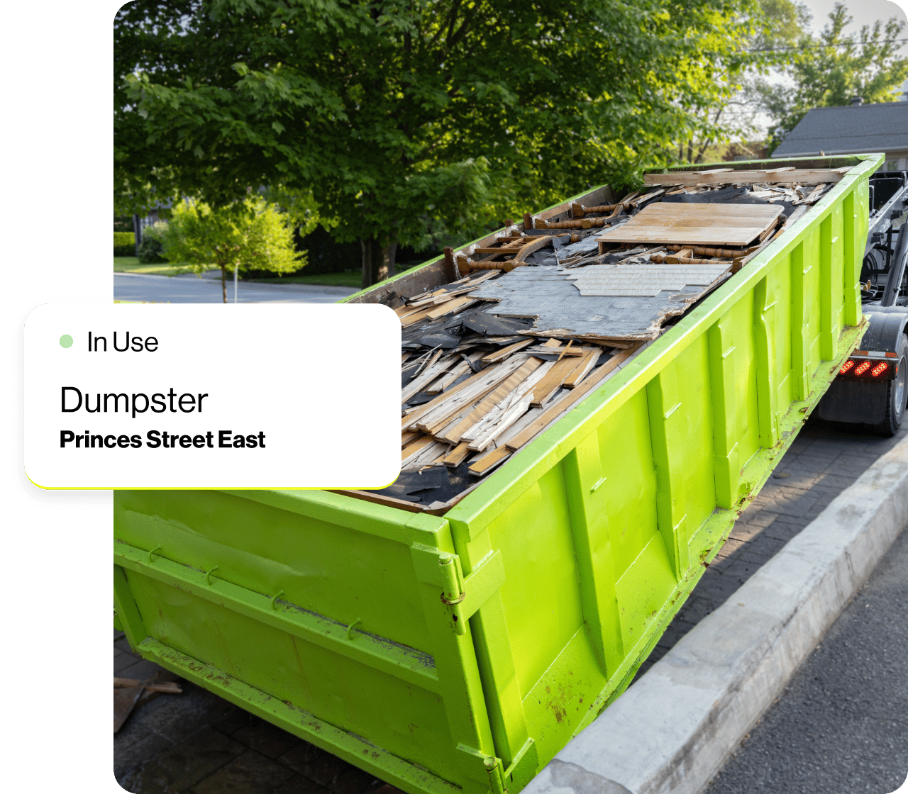 A dumpster full of scrap wood