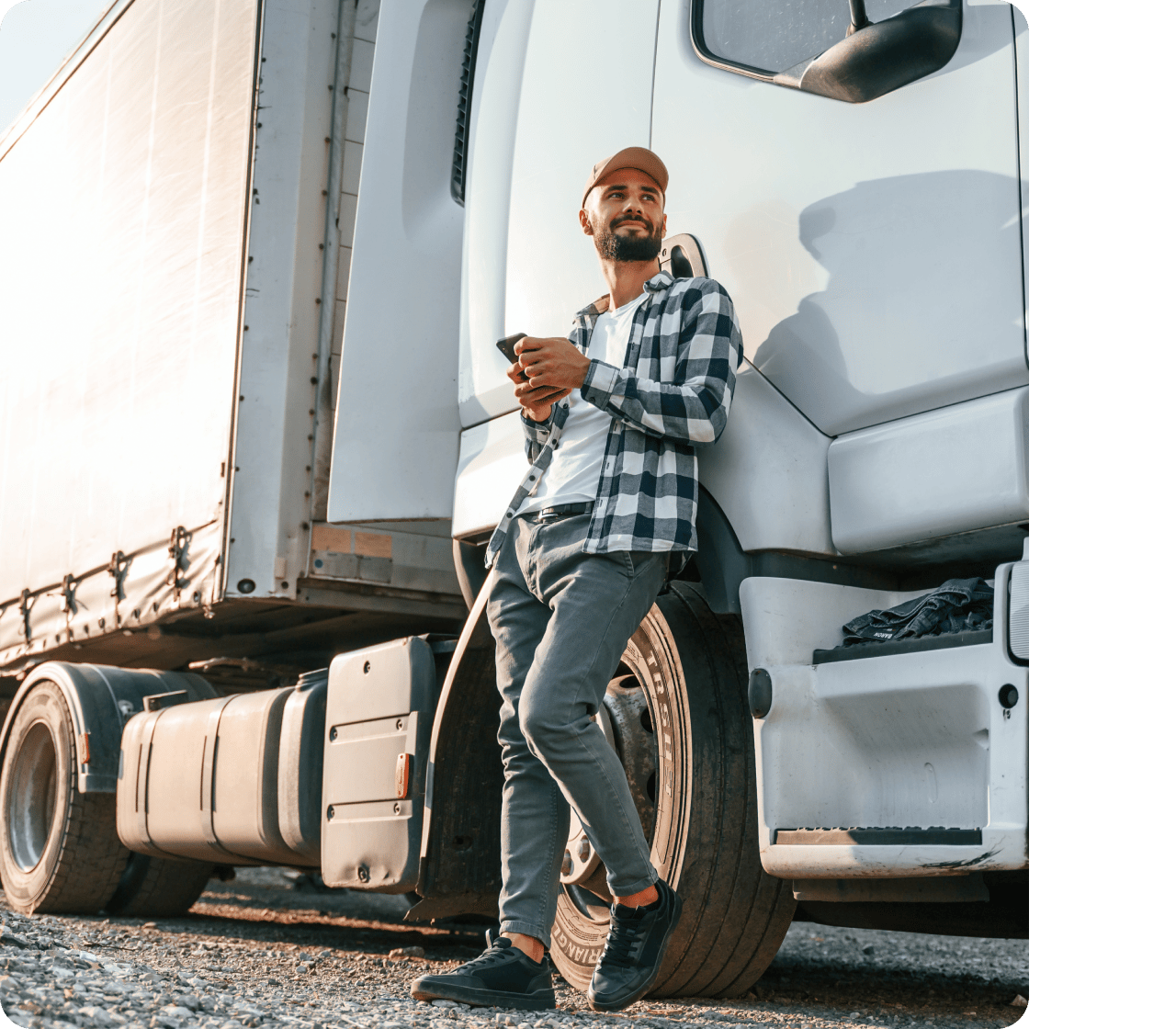 A truck driver checking his phone