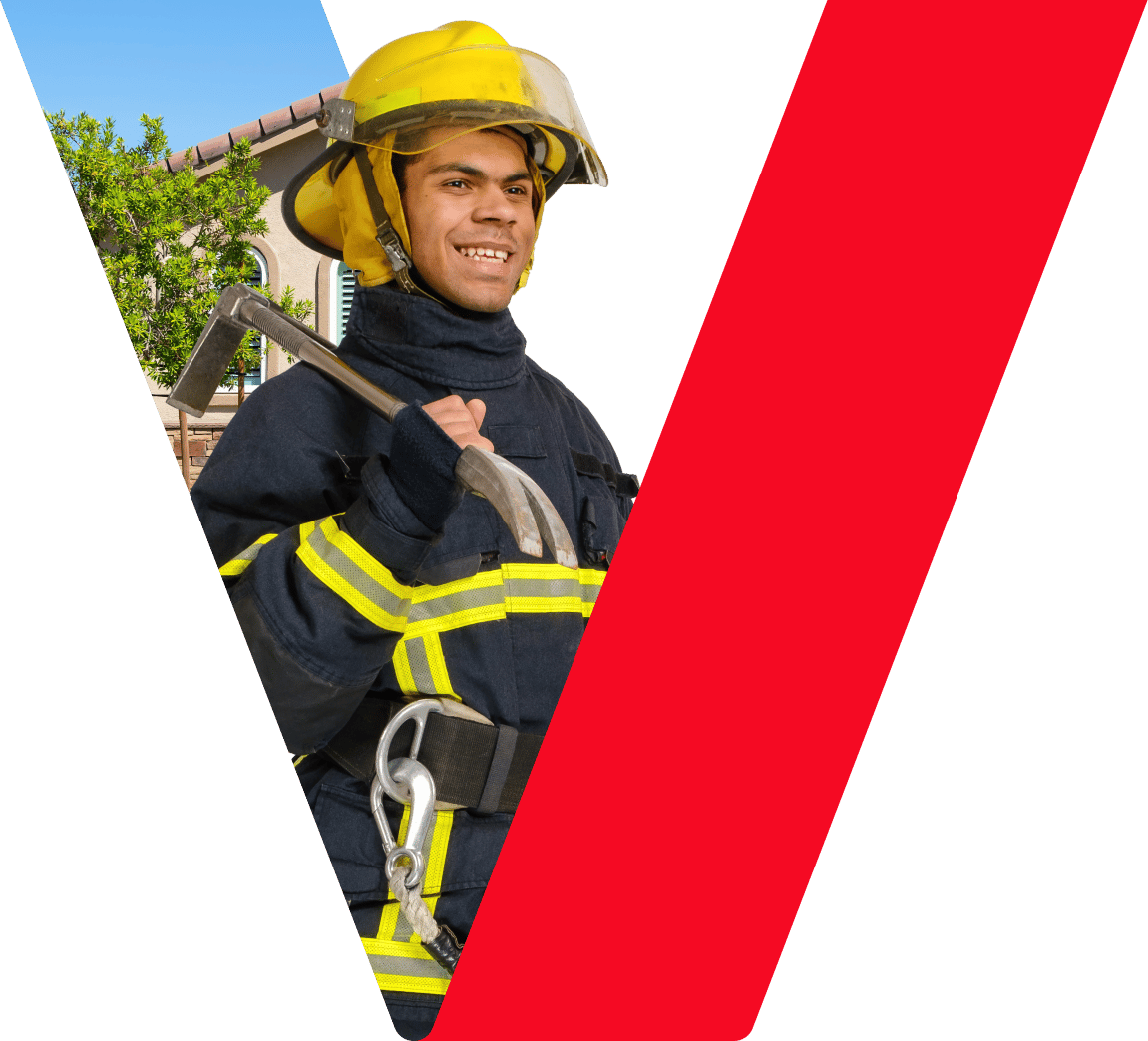 A firefighter holding a crowbar