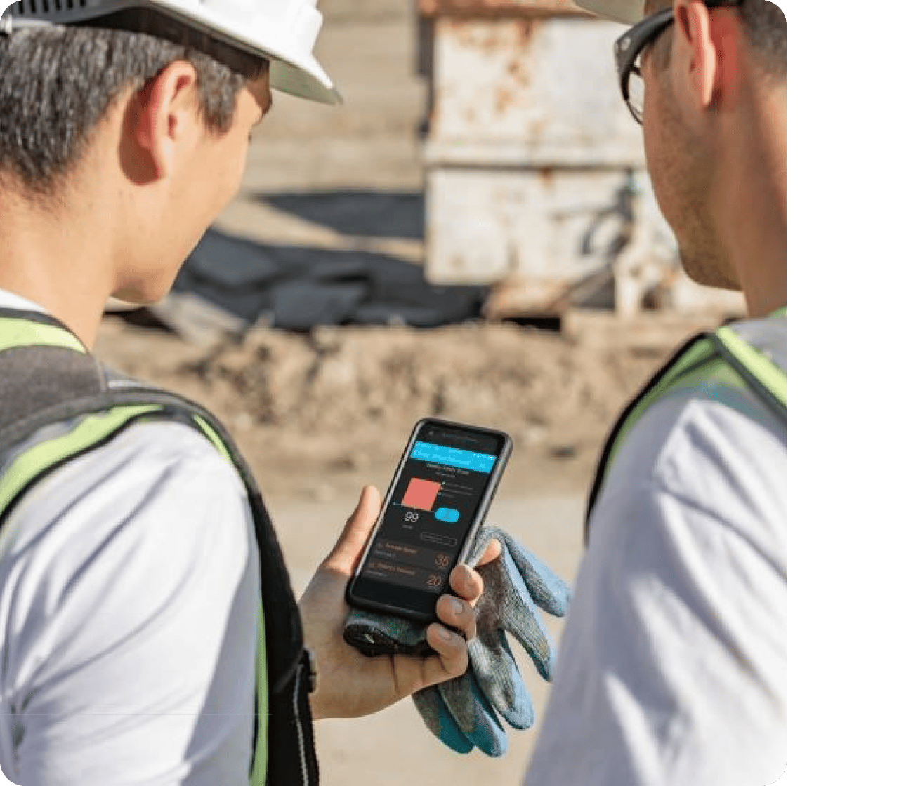 A man showing a coworker fleet data on his phone