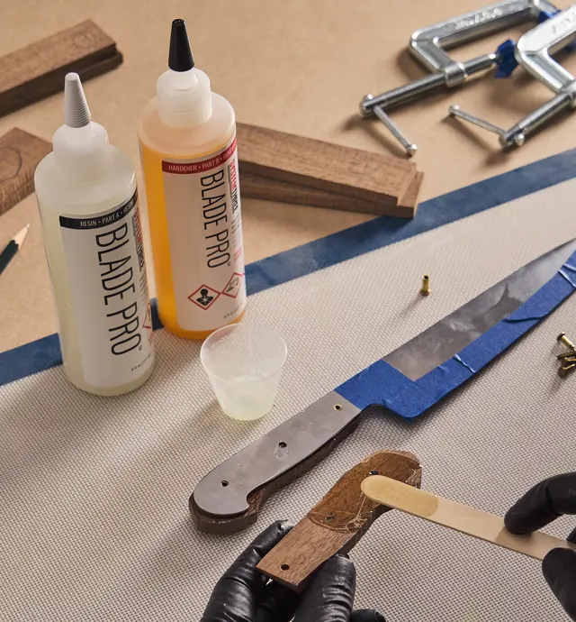 Applying Blade Pro epoxy to a wooden knife handle scale
