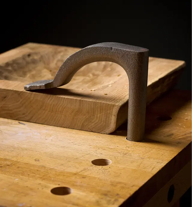 A Crucible holdfast clamps a workpiece to a benchtop