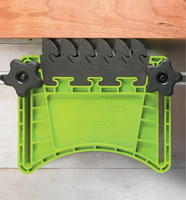 Featherboard with the EVA foam fingers closing up when experiencing kickback