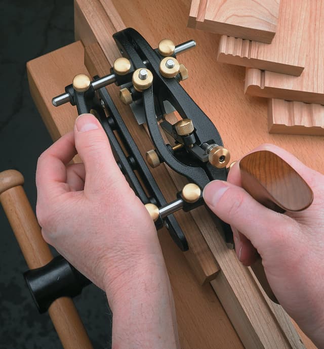 Using the combination plane to cut the groove for a tongue and groove joint on the side of board