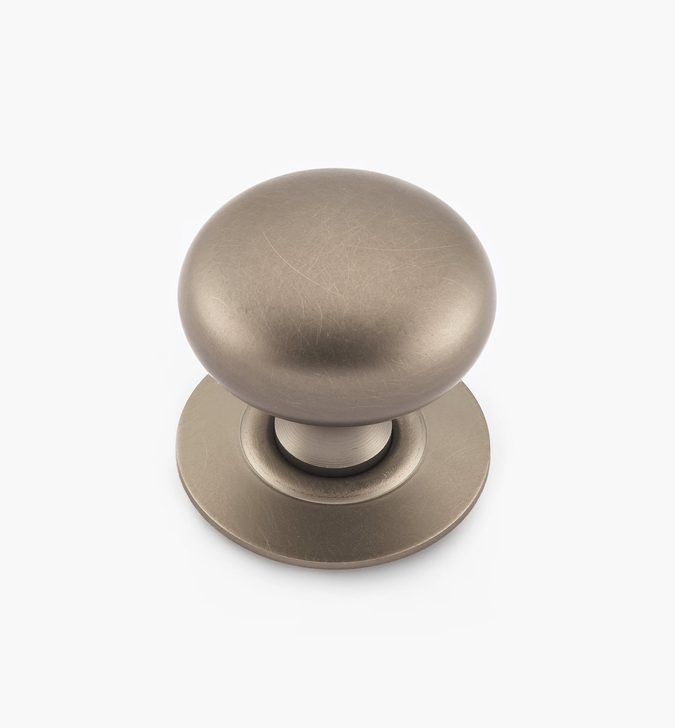 Bouton creux en laiton sur rosace