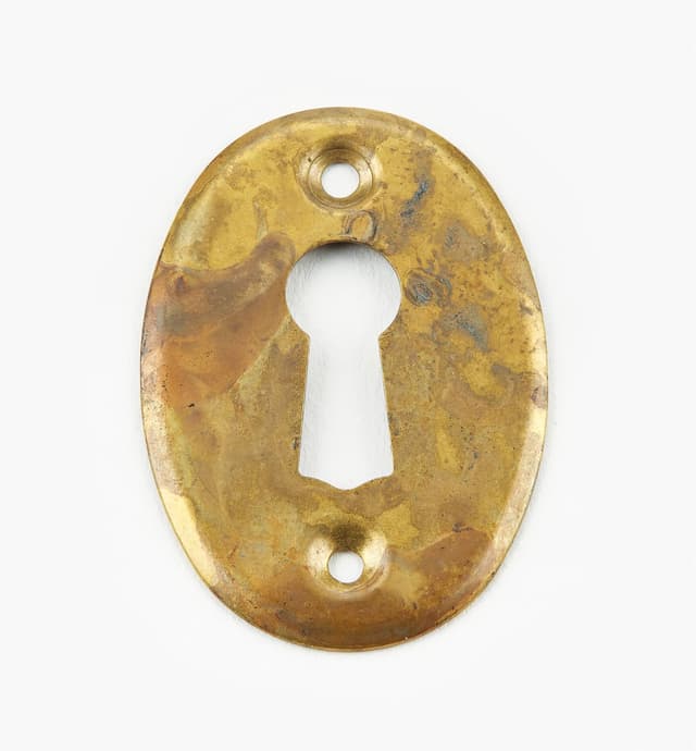 image of Entrées de serrure estampées en laiton ancien