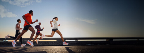 Group of people running wearing ASICS Rise and Shine collection