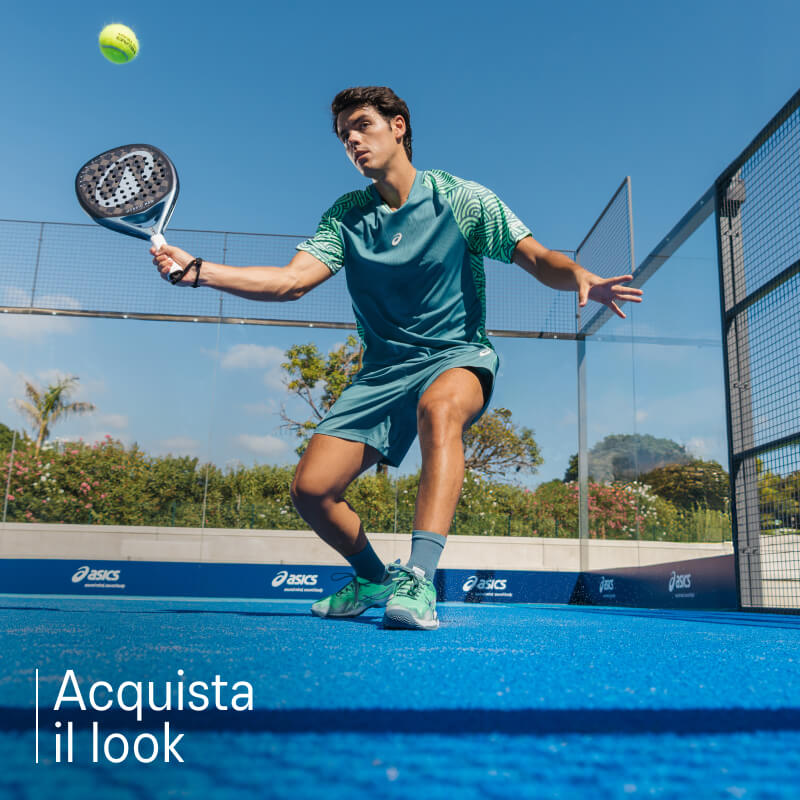 Athlete playing padel wearing padel shoes from ASICS on a blue court.