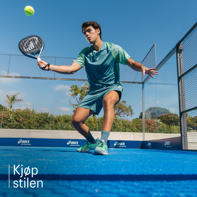 Athlete playing padel wearing padel shoes from ASICS on a blue court.