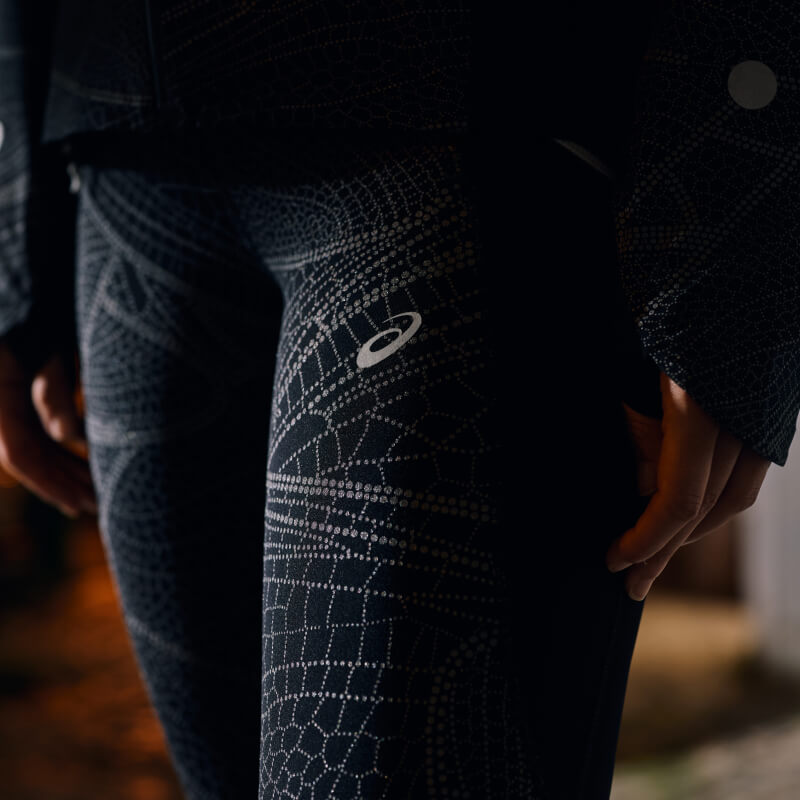 Woman wearing the limited series Lite-Show Tight by ASICS.