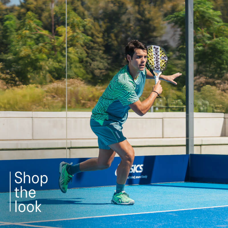 Athlete playing padel wearing padel shoes from ASICS on a blue court.