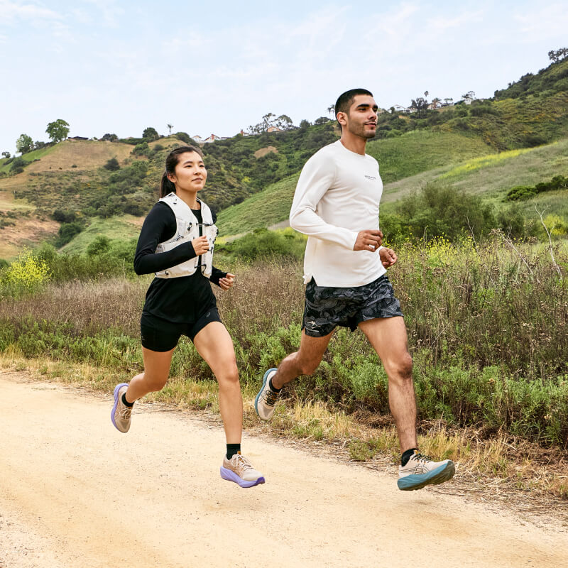 Female and male runner wearing ASICS Nature Bathing gear