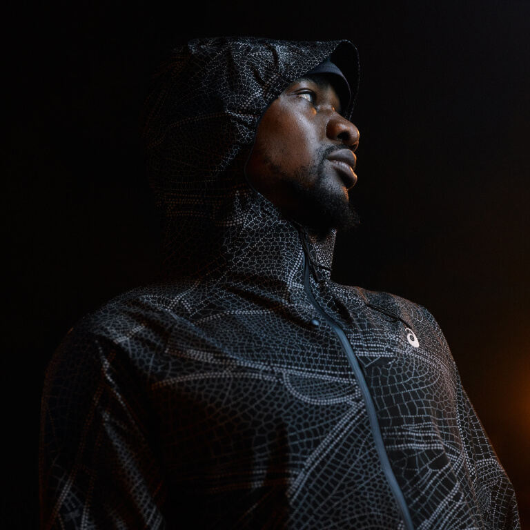 Runner wearing the limited series Lite-Show Jacket by ASICS.