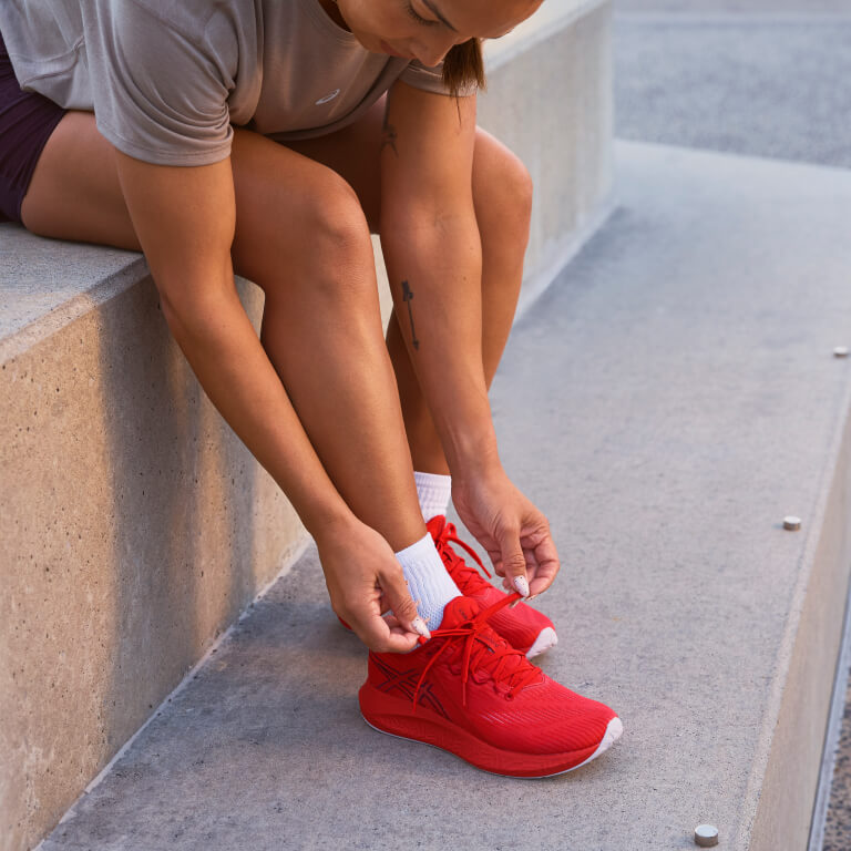 Woman wearing ASICS NAGINO BLOOMSTRIDE shoes