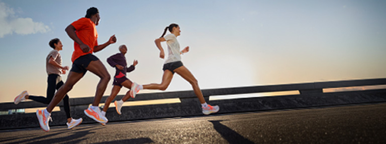 Group of people running wearing ASICS Rise and Shine collection