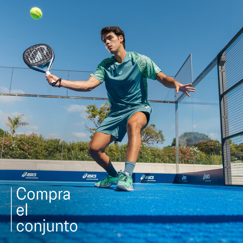 Athlete playing padel wearing padel shoes from ASICS on a blue court.