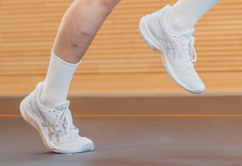 Close up on blue volleyball shoes called NETBURNER BALLISTIC