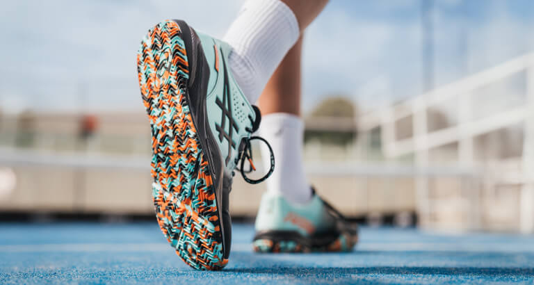 Close up of the limited edition GEL-CHALLENGER shoe from ASICS with a multicolored sole.