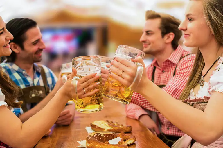 https://images.contentstack.io/v3/assets/blt06f605a34f1194ff/blt10890148afbb5ab4/645cffcf6606ca78e195d521/Prost-Oktoberfest-GetYourGuide.jpeg