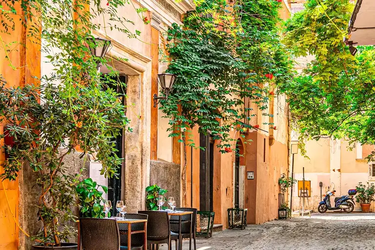 Restaurant terrace on the cobbled streets of the Trastevere neighborhood