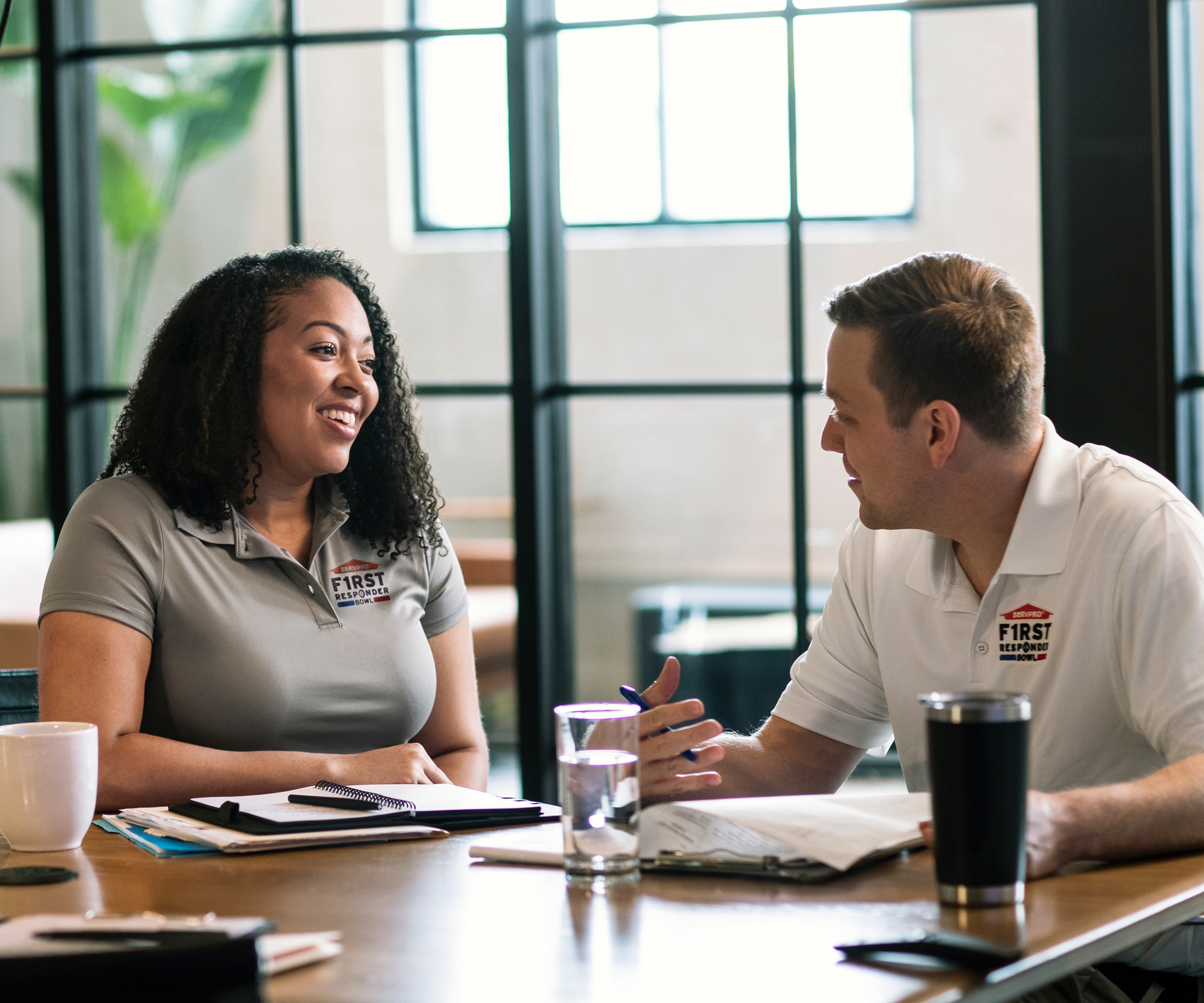 2 people speaking to each other around a table at work
SERV1444 Three Year usage. Limited to Internal use at corporate on digital, social and website, with three yea print usage beginning 10/1/2021