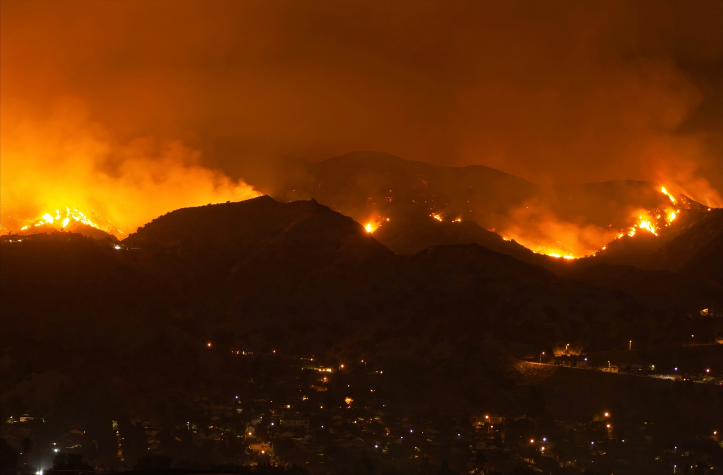 Photo of California wildfire with hillside on fire
