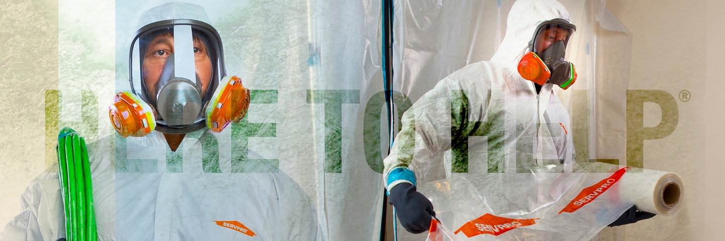 SERVPRO employee in hazmat suit