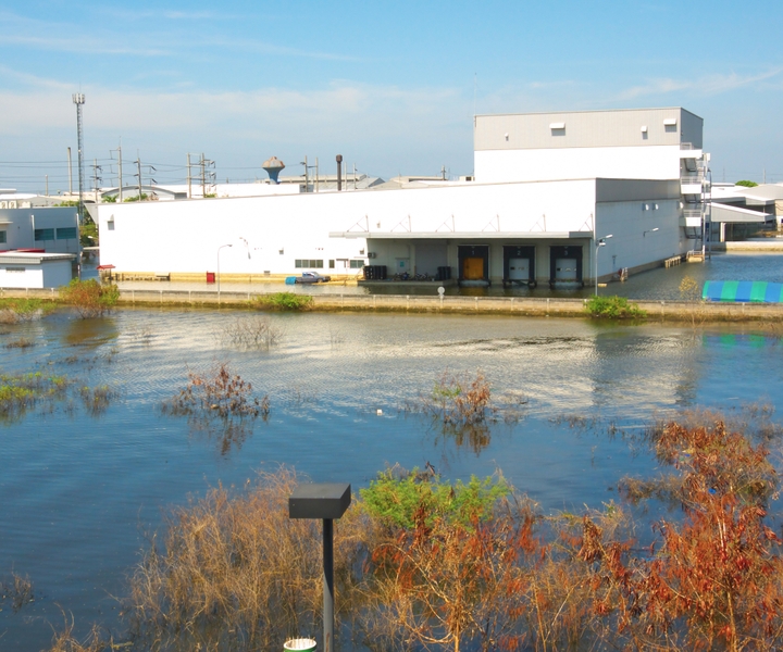 External view of flooded factory and parking lot