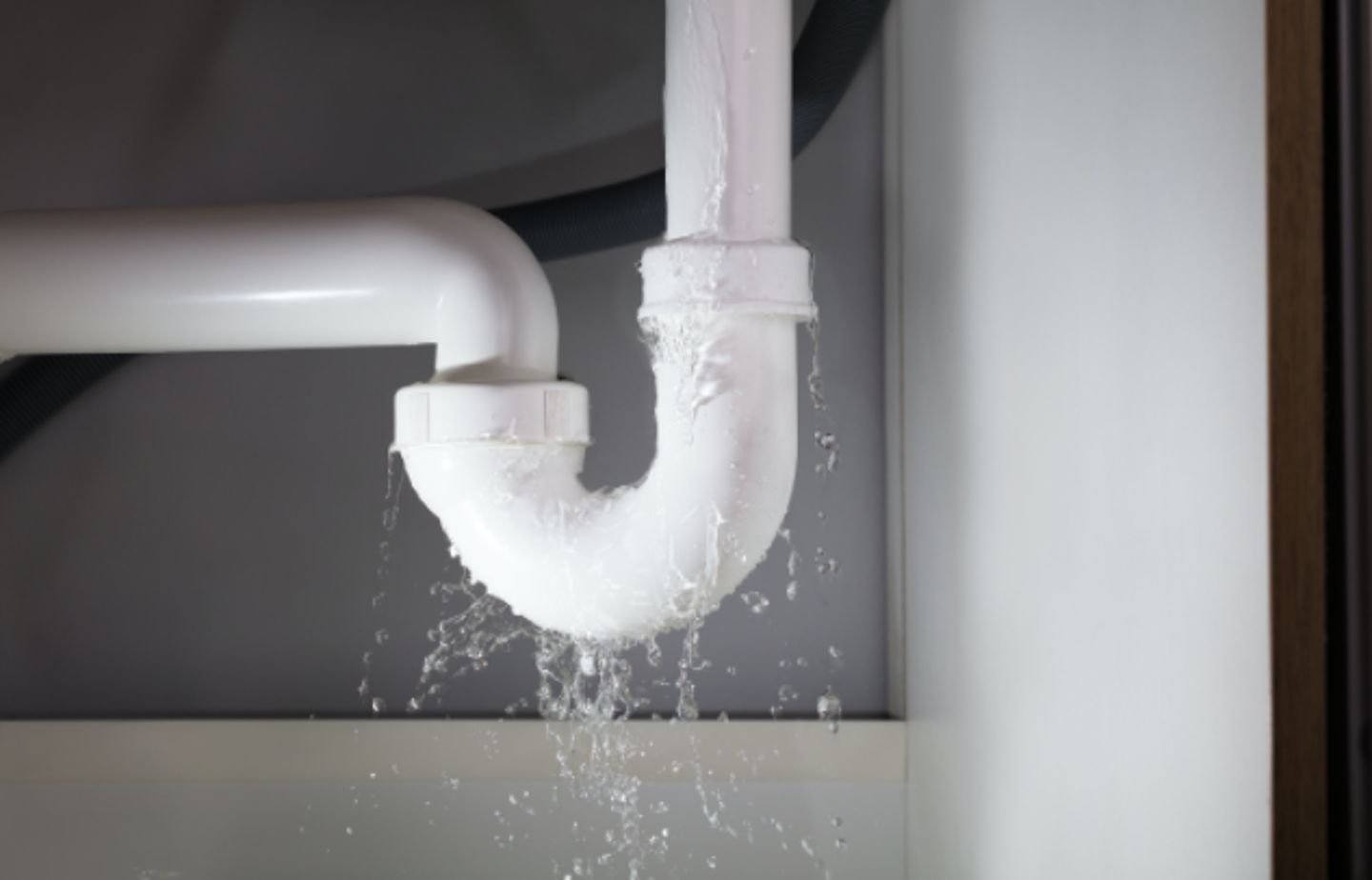 water leaking under bathroom sink cabinet