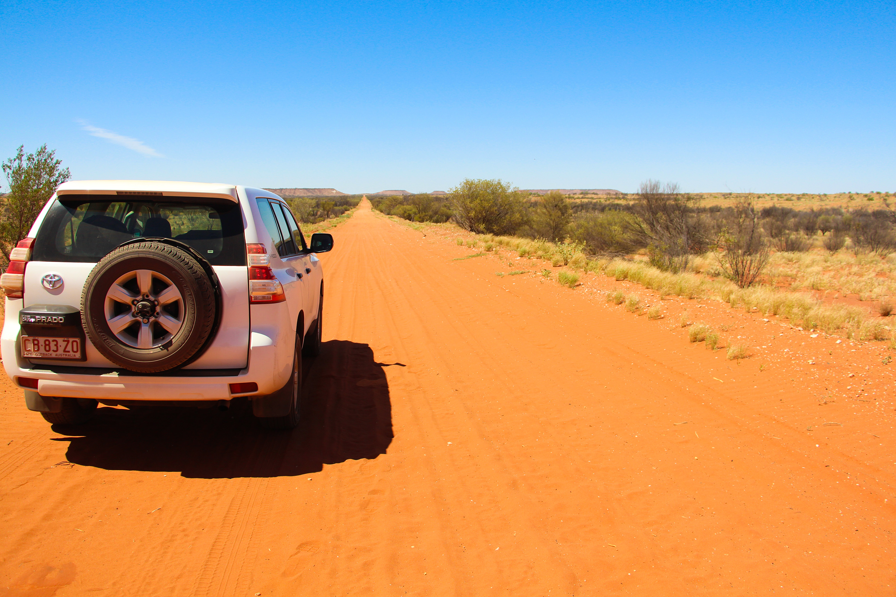 4WD driving on dirt road through Simpson Desert