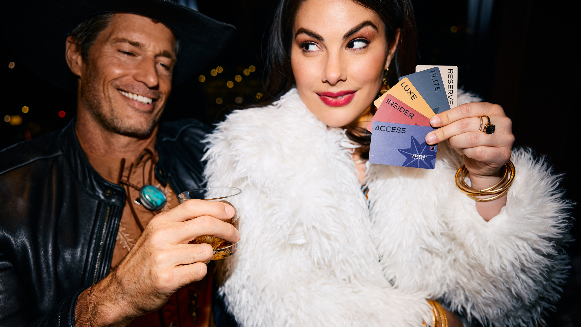 Girl Holding Status+ Cards