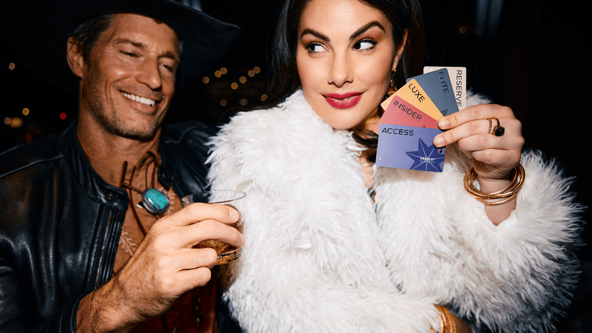 Girl Holding Status+ Cards
