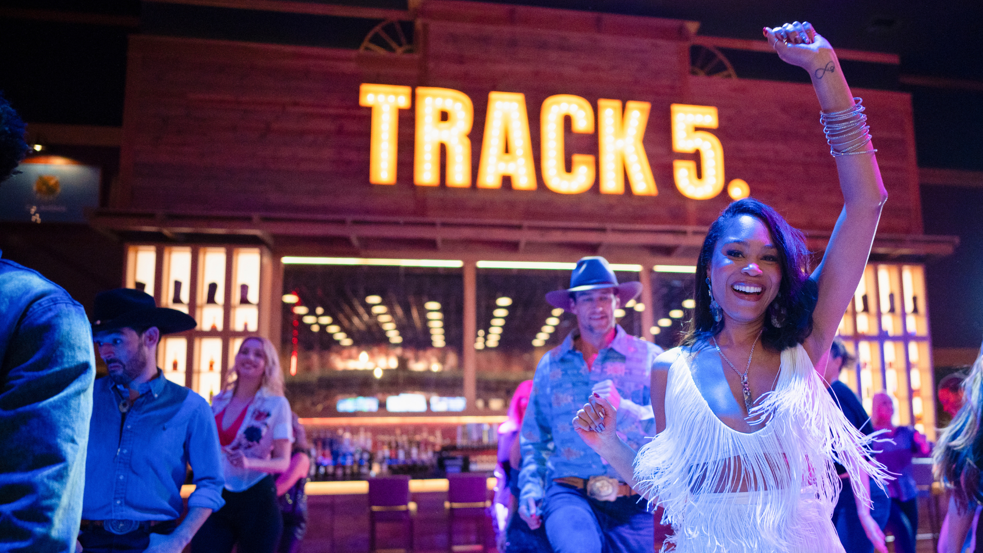 People line dancing at Track 5.