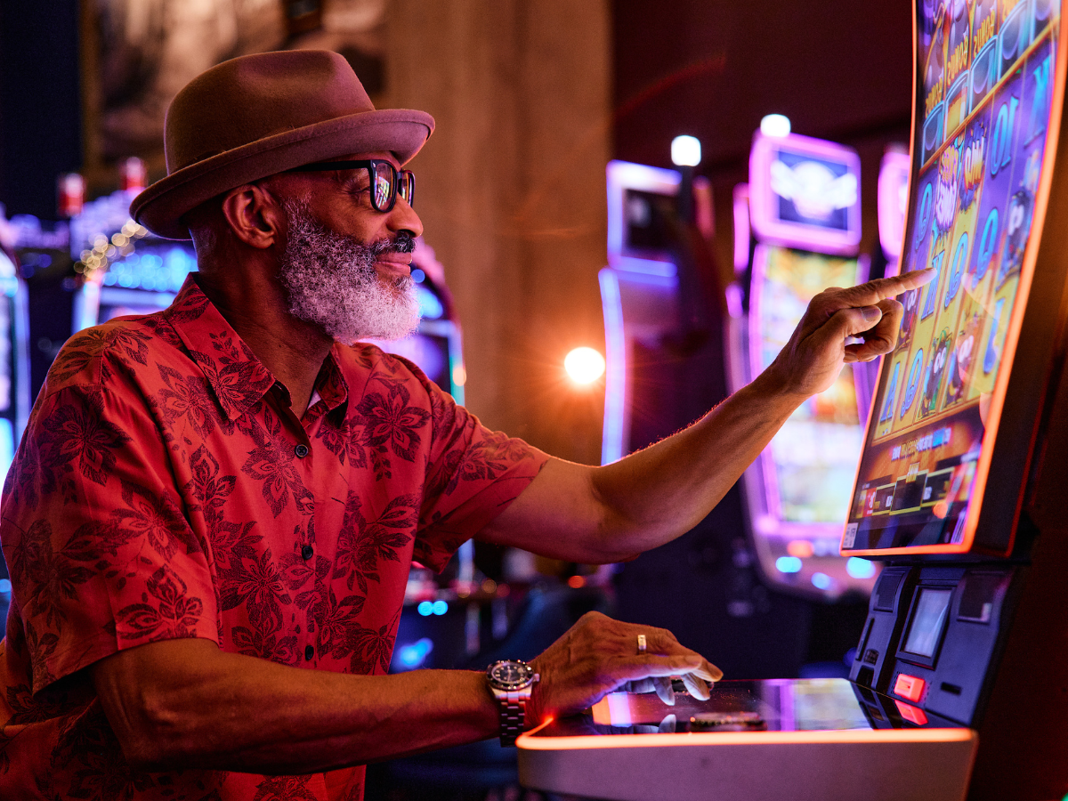 Cool guy playing slot machine