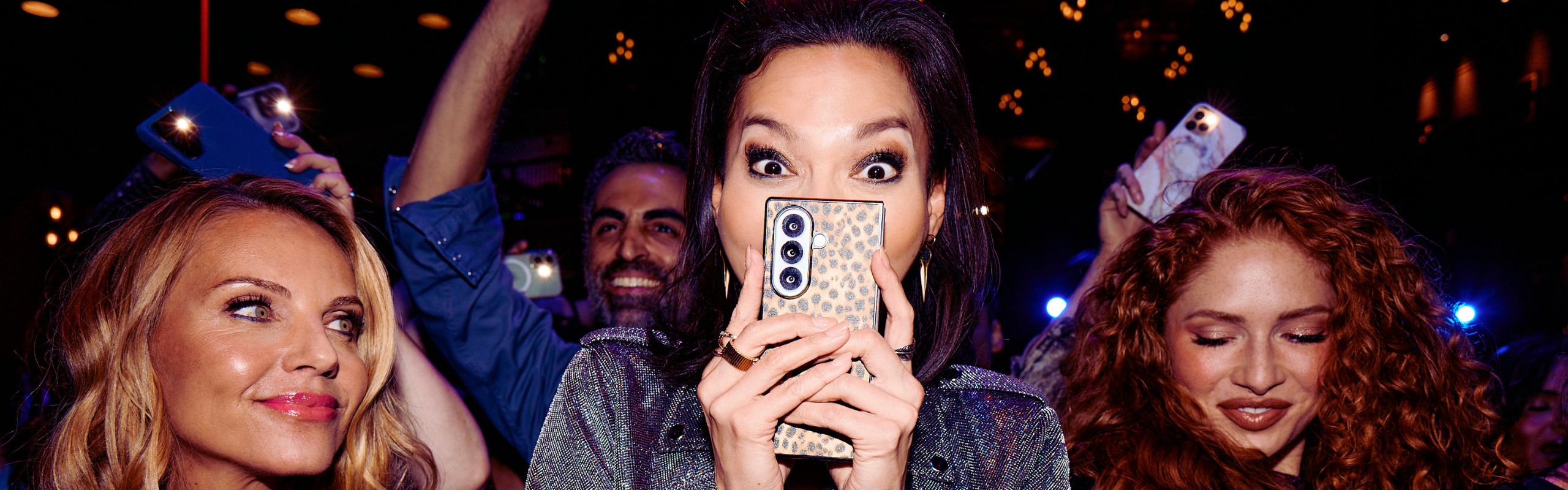 Woman holding cheetah print phone
