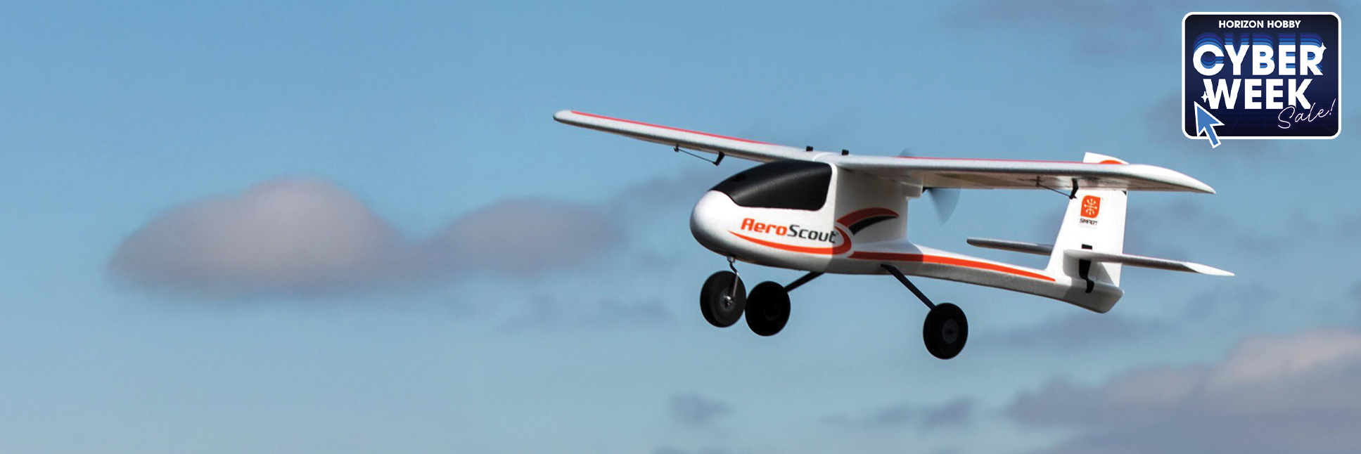 Action shot of the HobbyZone AeroScout S 2 1.1m Ready-to-Fly Basic RC Trainer Airplane with SAFE flying through the sky with the Cyber Week Sale Logo Action shot of the HobbyZone AeroScout S 2 1.1m Ready-to-Fly Basic RC Trainer Airplane with SAFE flying through the sky with the Cyber Week Sale Logo