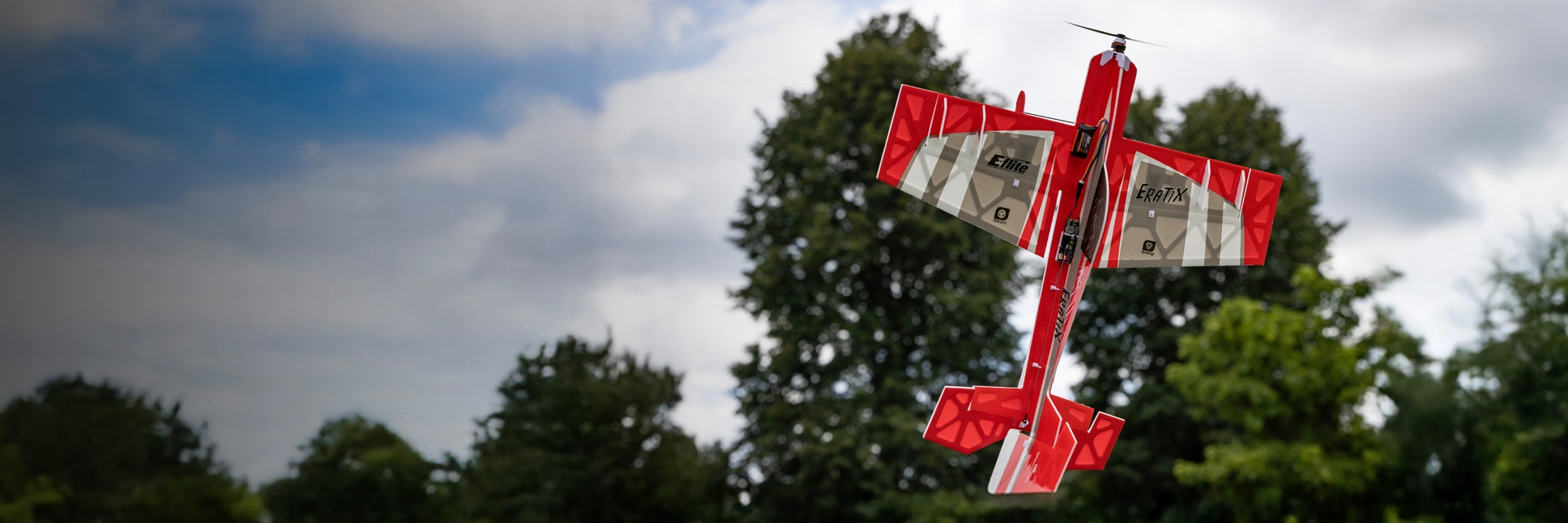 Action shot of the E-flite UMX Eratix 3D FF (Flat Foamy) 450mm Bind-N-Fly Basic RC Airplane with AS3X and SAFE Select flying through the sky and performing a 3D aerobatic move Action shot of the E-flite UMX Eratix 3D FF (Flat Foamy) 450mm Bind-N-Fly Basic RC Airplane with AS3X and SAFE Select flying through the sky and performing a 3D aerobatic move