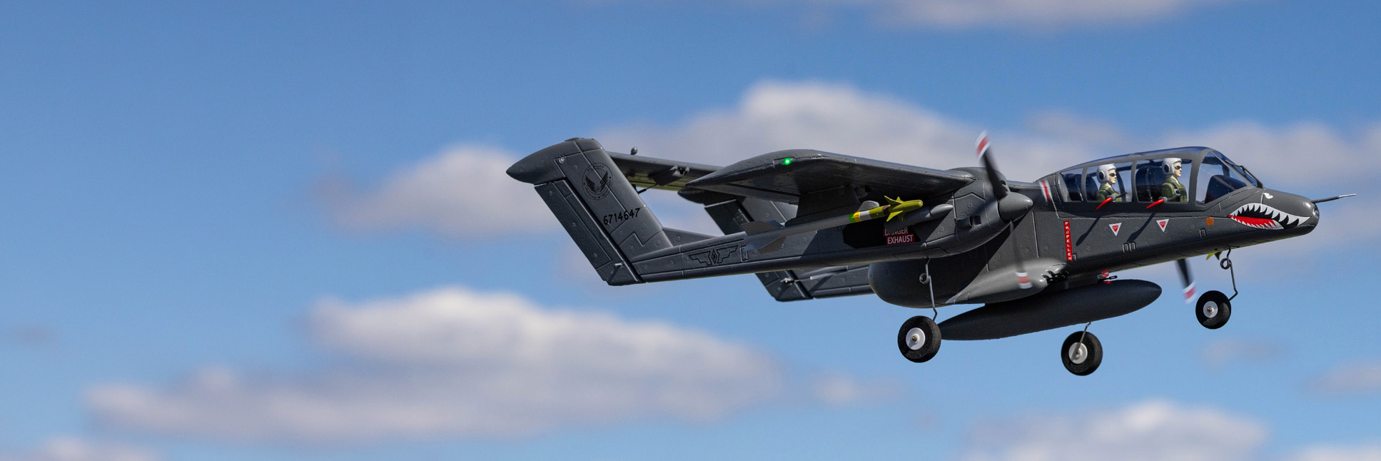Action shot of the E-flite Micro OV-10 Bronco 645mm Bind-N-Fly Basic with AS3X and SAFE Select RC Aircraft flying through the air