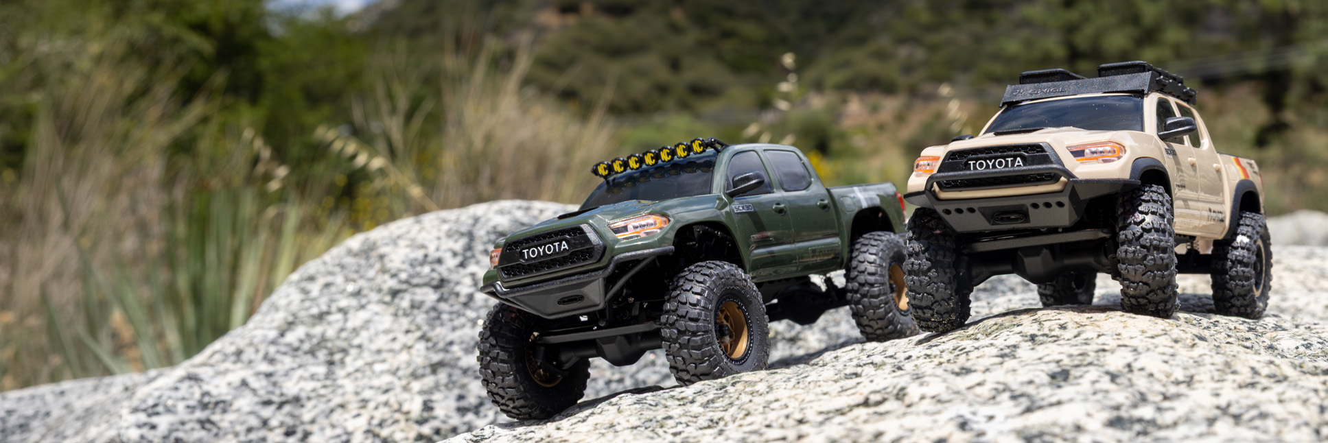 Action shot of the 1/30 Axial SCX30 Toyota Tacoma RC Rock Crawler climbing over rocks