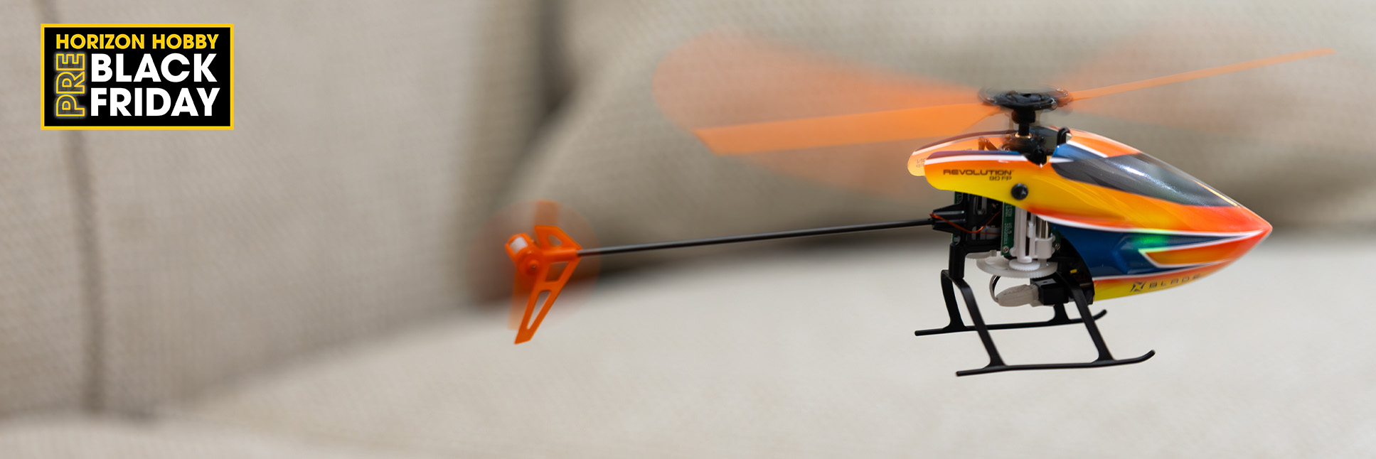 Blade Revolution 90 FP RTF with SAFE flying indoors above a couch Blade Revolution 90 FP RTF with SAFE flying indoors above a couch