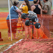 RC Monster truck getting air during the RC Fest Monster Truck Freestyle event