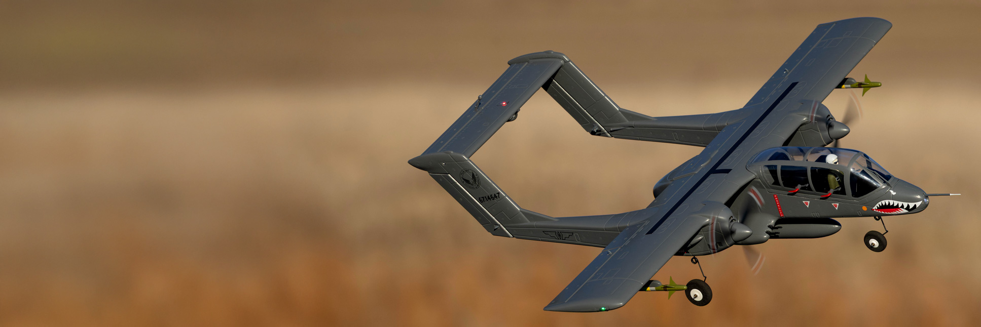 Action shot of the E-flite Micro OV-10 Bronco 645mm Bind-N-Fly Basic with AS3X and SAFE Select RC Aircraft flying through the air