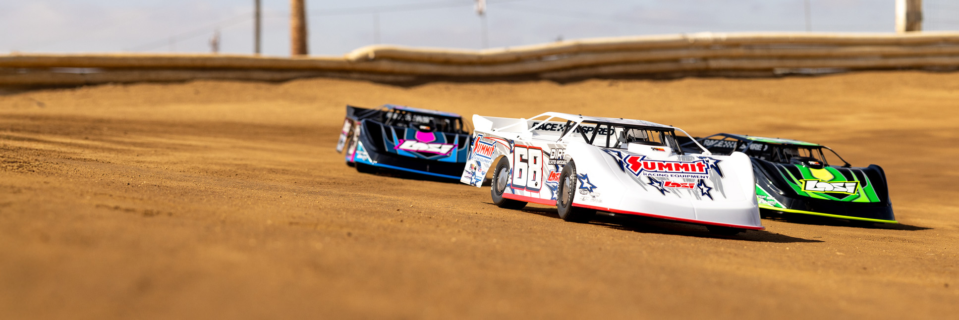 Action shot of the Losi 22S Dirt Late Model racing on the dirt oval track Action shot of the Losi 22S Dirt Late Model racing on the dirt oval track
