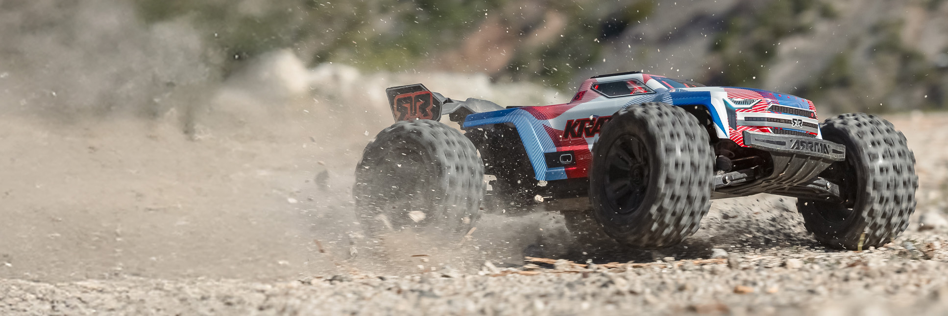 Action shot of the 1/8 KRATON 6S 4X4 RTR Brushless RC Speed Truck bashing through dirt terrain Action shot of the 1/8 KRATON 6S 4X4 RTR Brushless RC Speed Truck bashing through dirt terrain