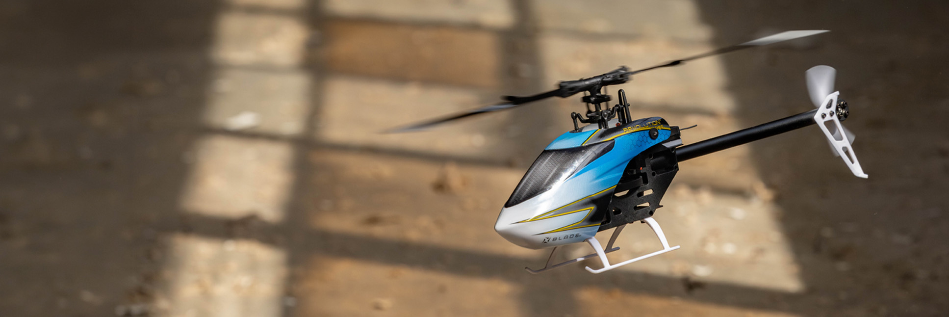 Action shot of the Blade Revolution 155 CP RC helicopter hovering in the air Action shot of the Blade Revolution 155 CP RC helicopter hovering in the air